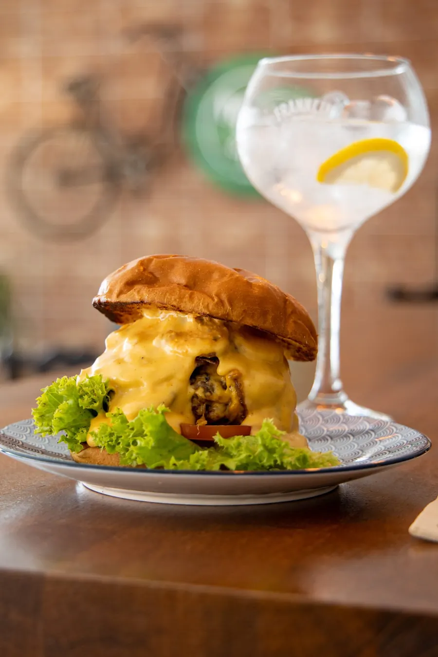 Burger served with a gin and tonic