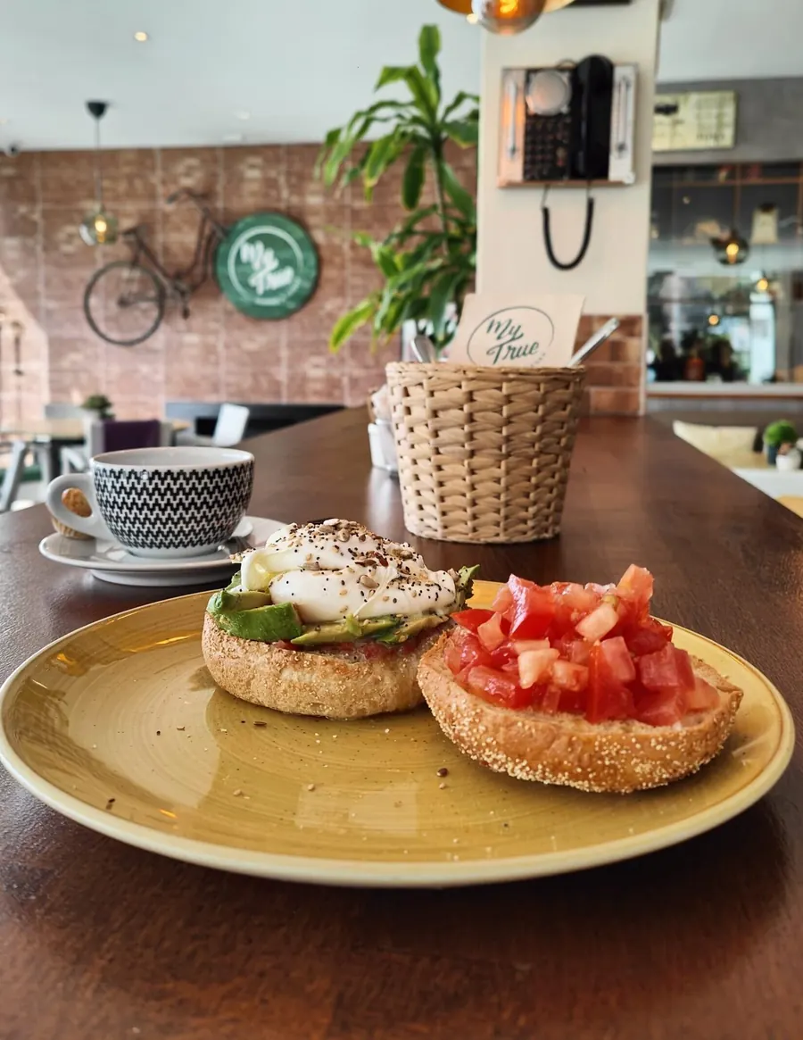 Breakfast plate with eggs, tomato and avocado
