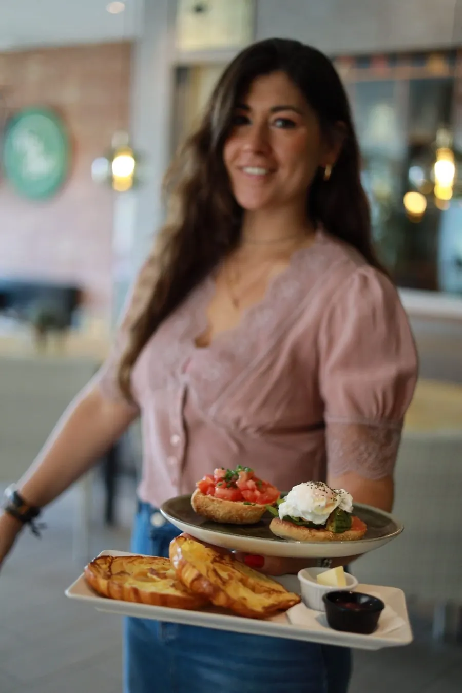 A waitress carrying a breakfast tray