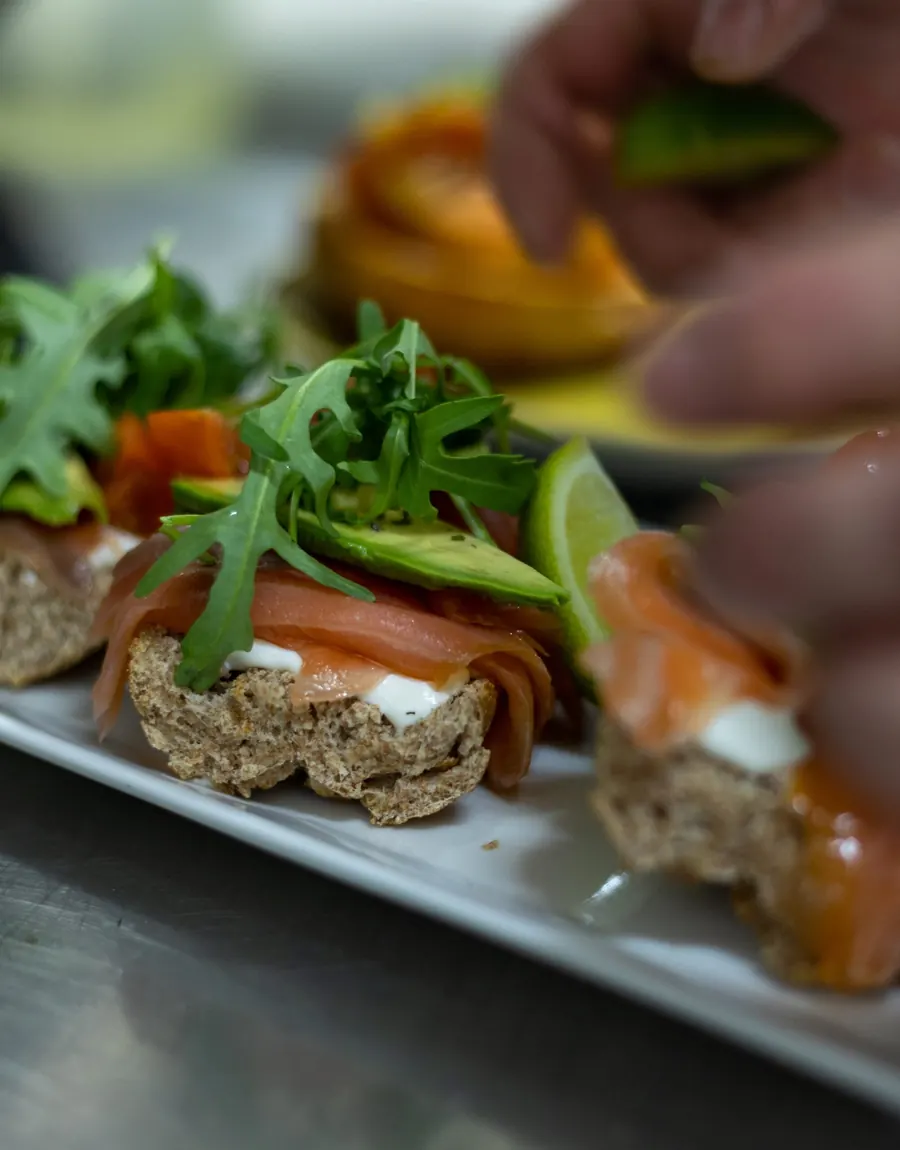 Smoked salmon toast with avocado and arugula